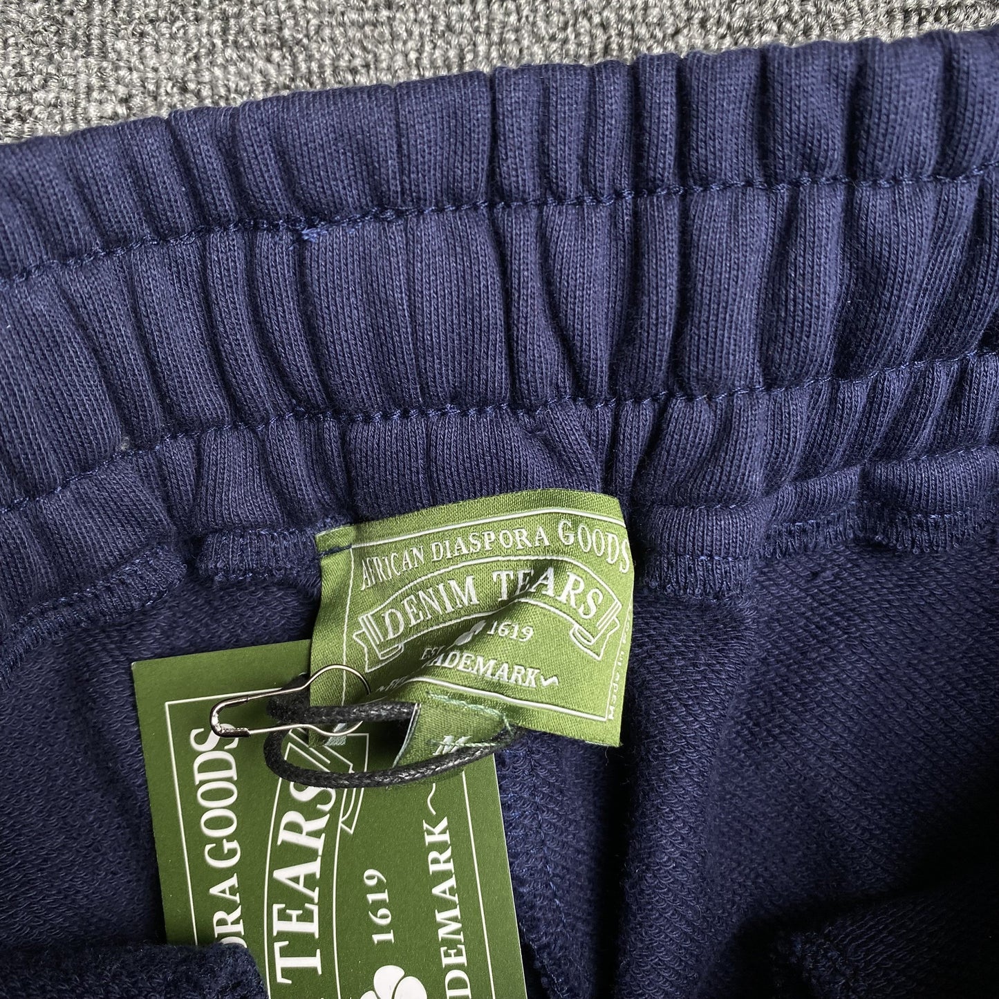 DENIM TEARS COTTON WREATH SWEATPANTS NAVY - Vanté®