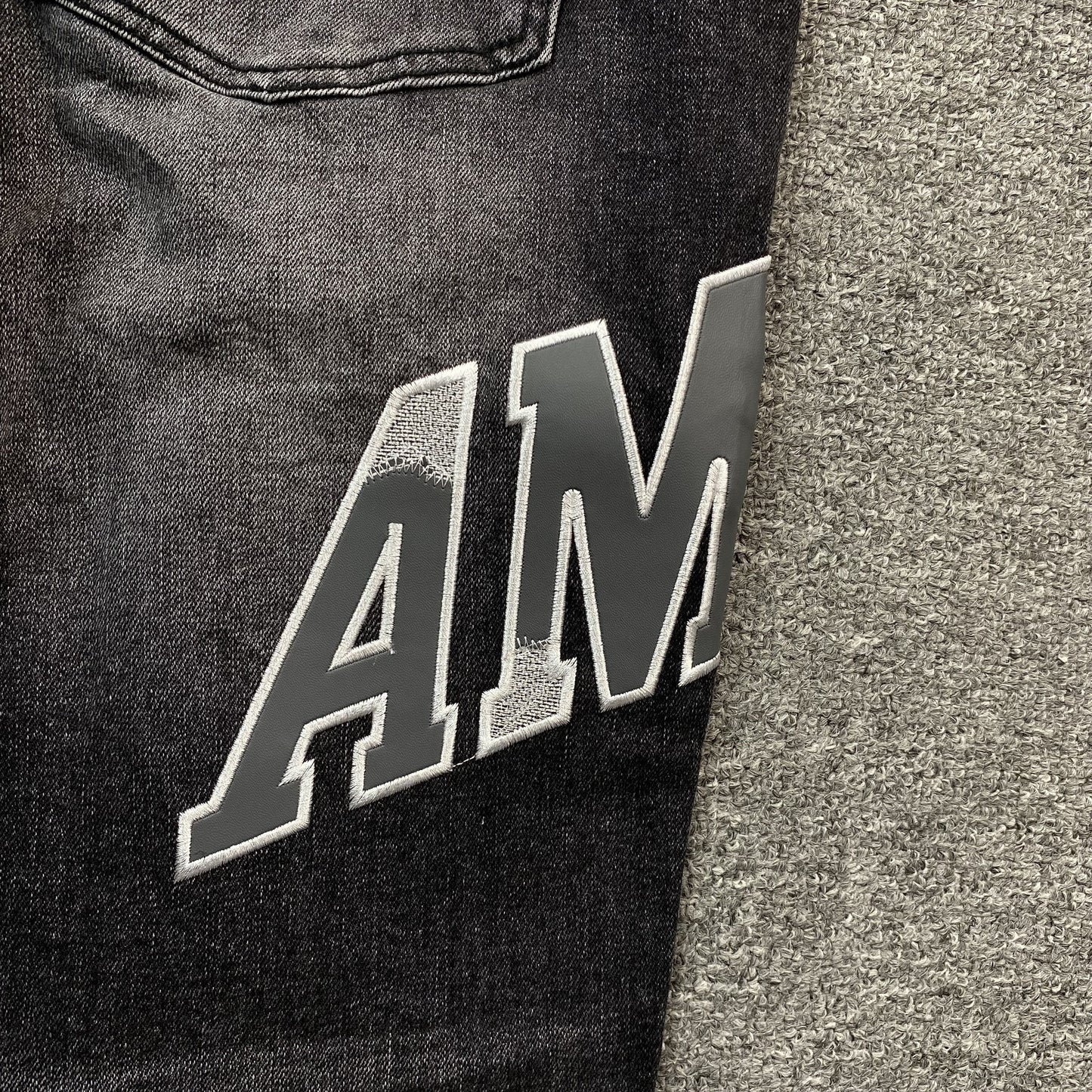 AMIRI VARSITY LOGO REPAIR JEANS - Vanté®