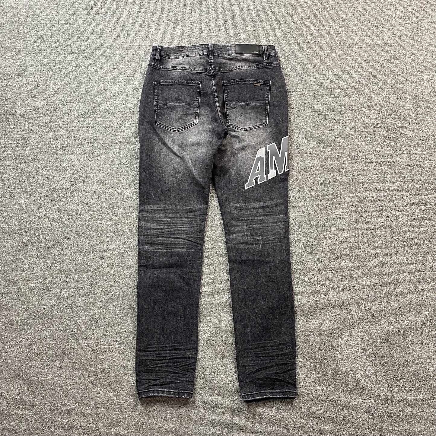 AMIRI VARSITY LOGO REPAIR JEANS - Vanté®