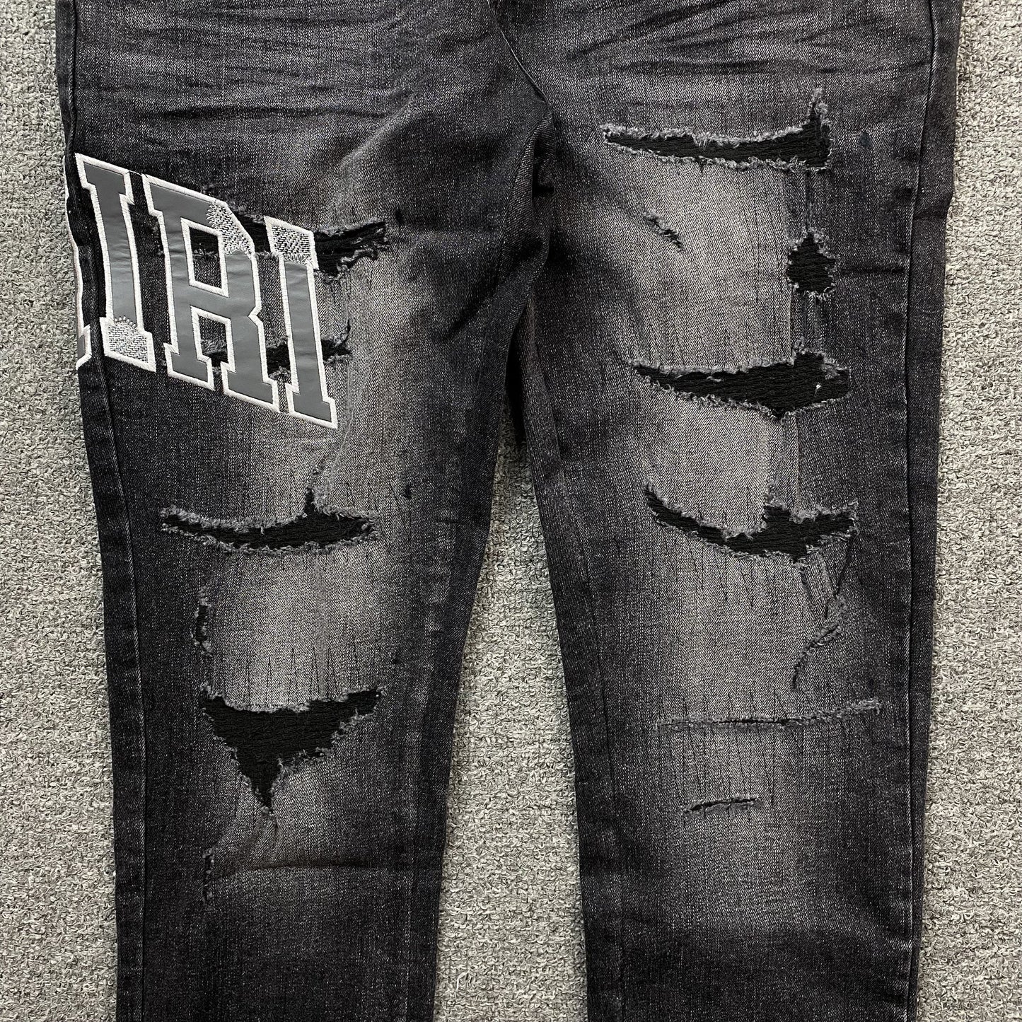 AMIRI VARSITY LOGO REPAIR JEANS - Vanté®
