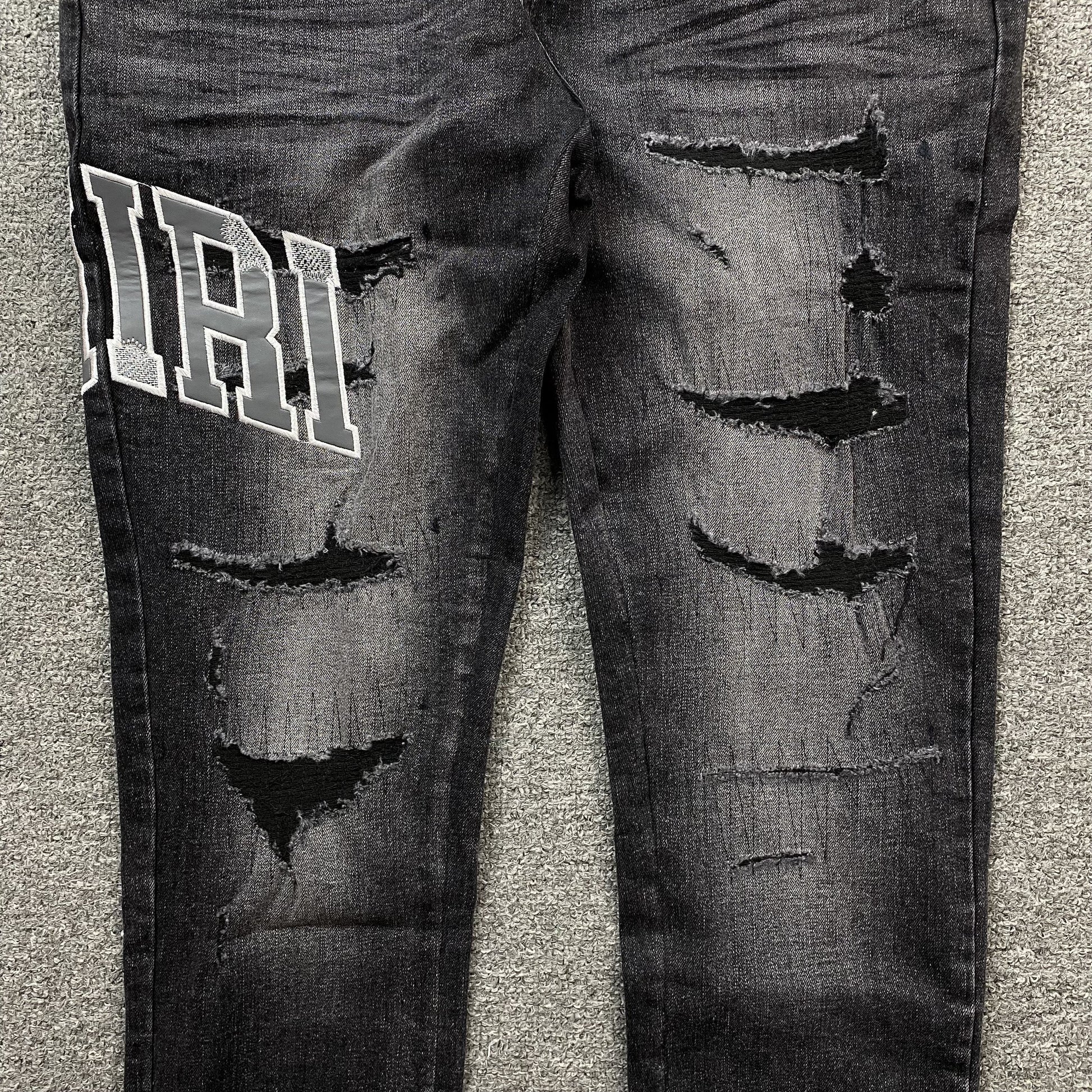 AMIRI VARSITY LOGO REPAIR JEANS - Vanté®