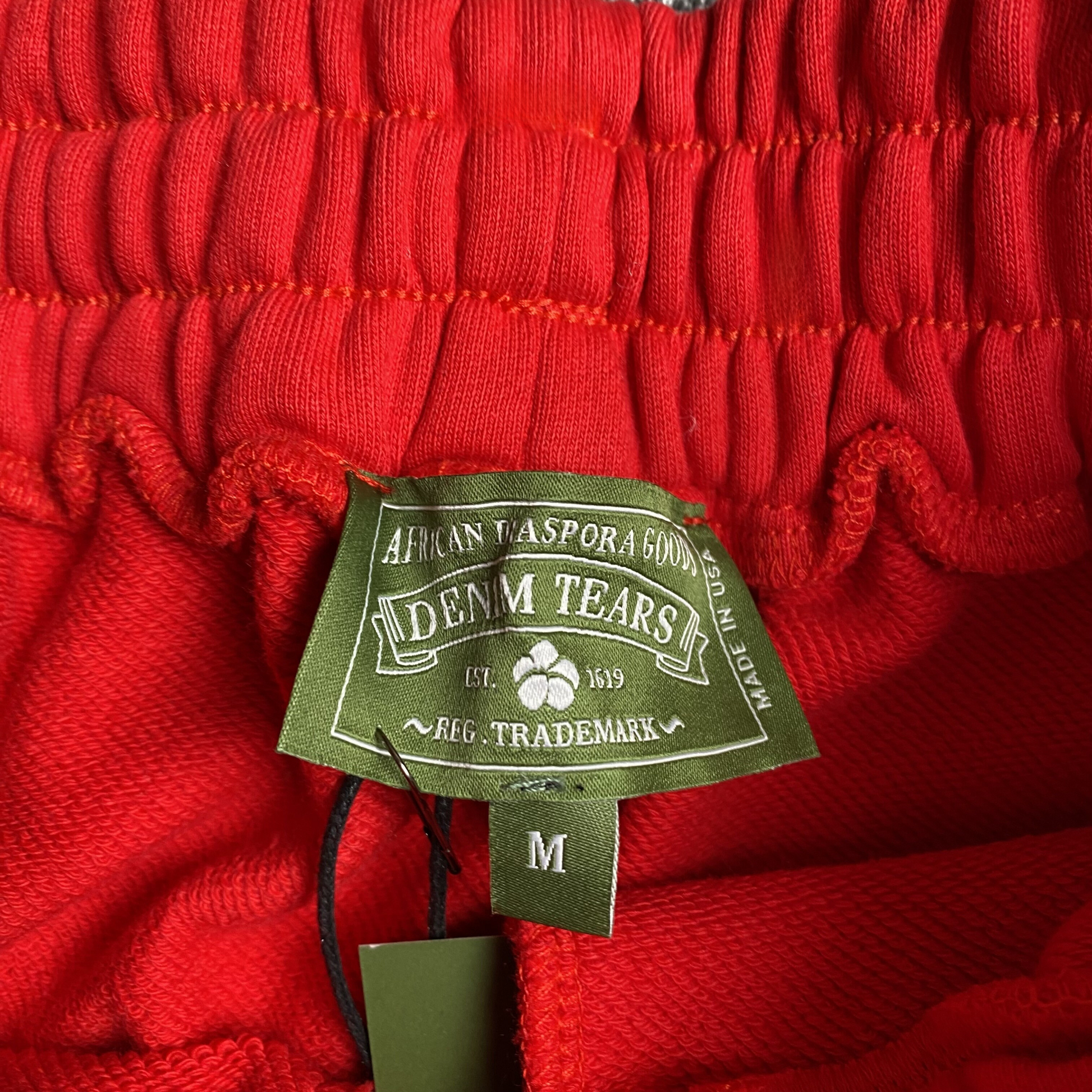 DENIM TEARS COTTON WREATH SWEATPANTS RED - Vanté®