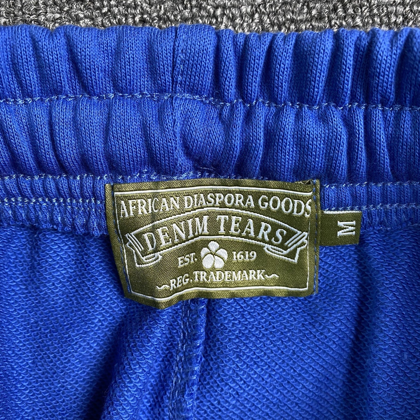 DENIM TEARS COTTON WREATH SWEATPANTS DEEP BLUE - Vanté®